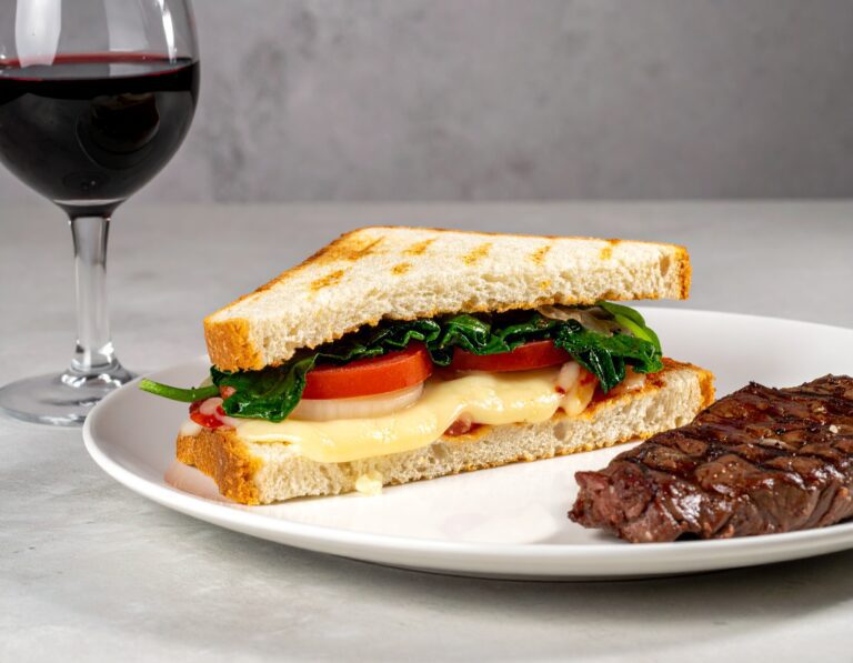 Firefly a realistic photo of a Cheese and tomato and onion and spinach closed braai sandwich on whit-2
