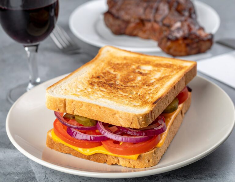 Firefly a realistic photo of a Cheese and tomato and onion closed braai sandwich on white bread slic-2