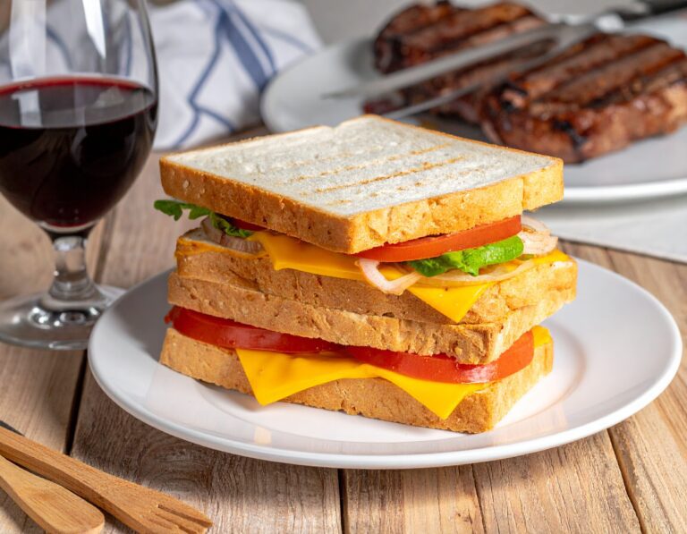 Firefly a realistic photo of a Cheese and tomato and onion closed braai sandwich on white bread slic-3